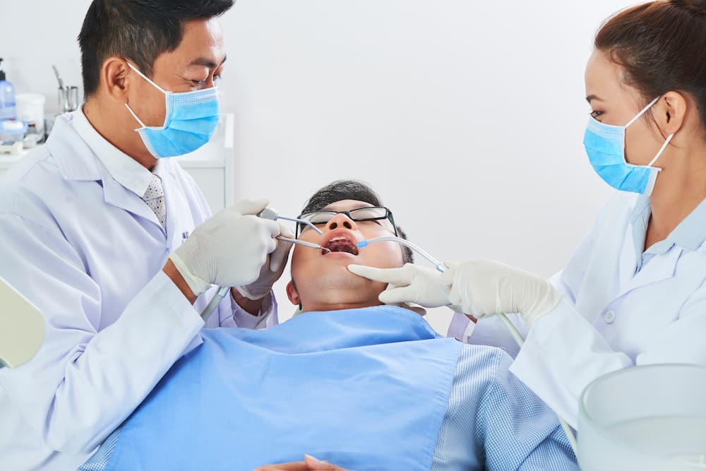 two asian dentists working AP6SKMF