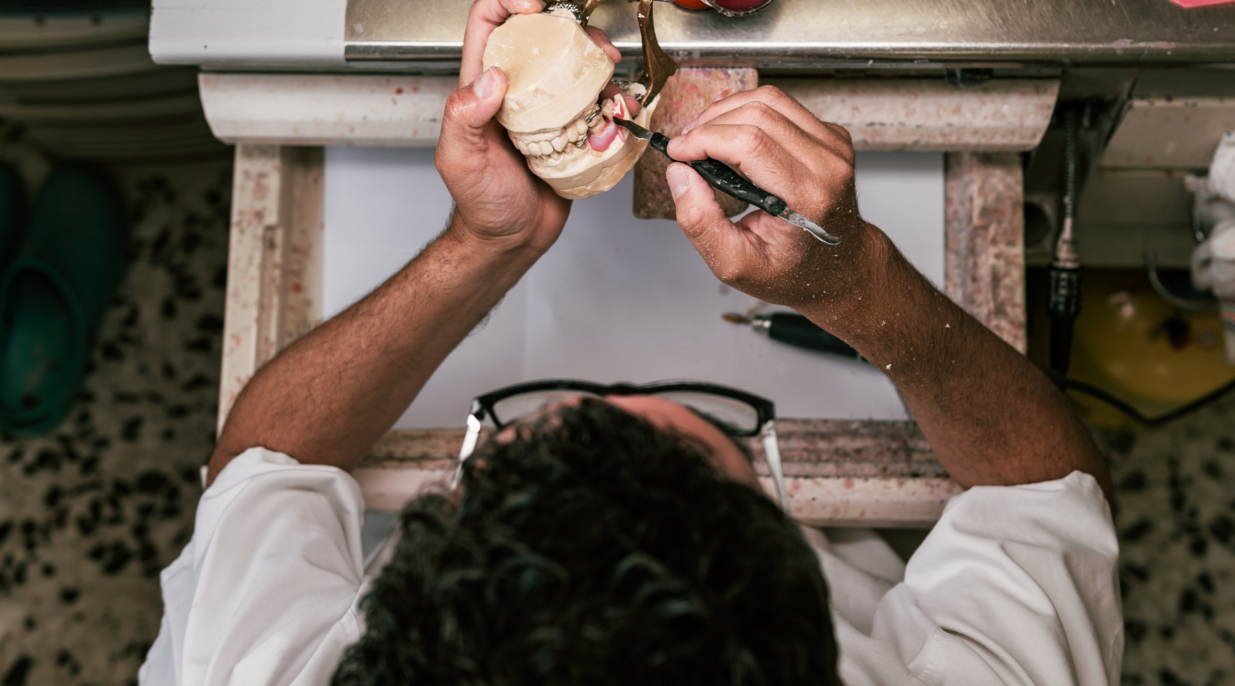 dental technician fixing the parts of a dental pro 2022 05 03 23 10 14 utc